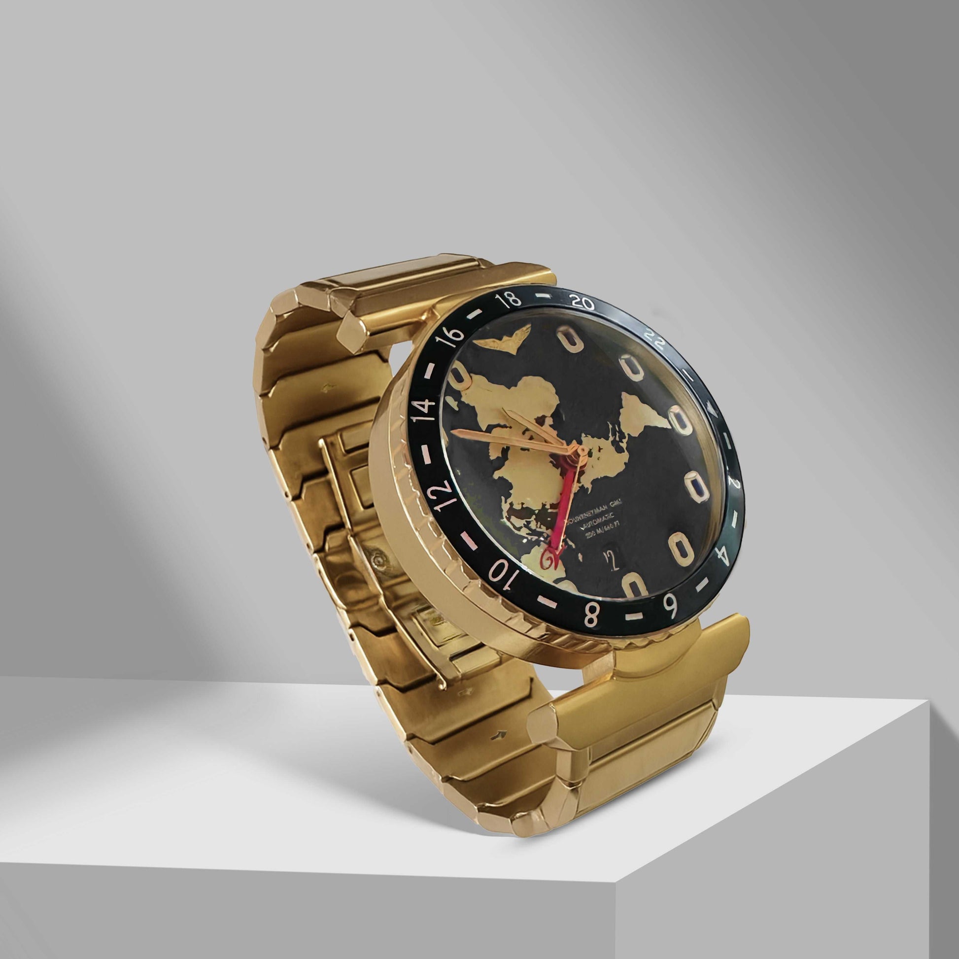 Golden Journeyman GMT watch with world map dial, red GMT hand, airplane window hour markers, and brushed 43mm automatic case.