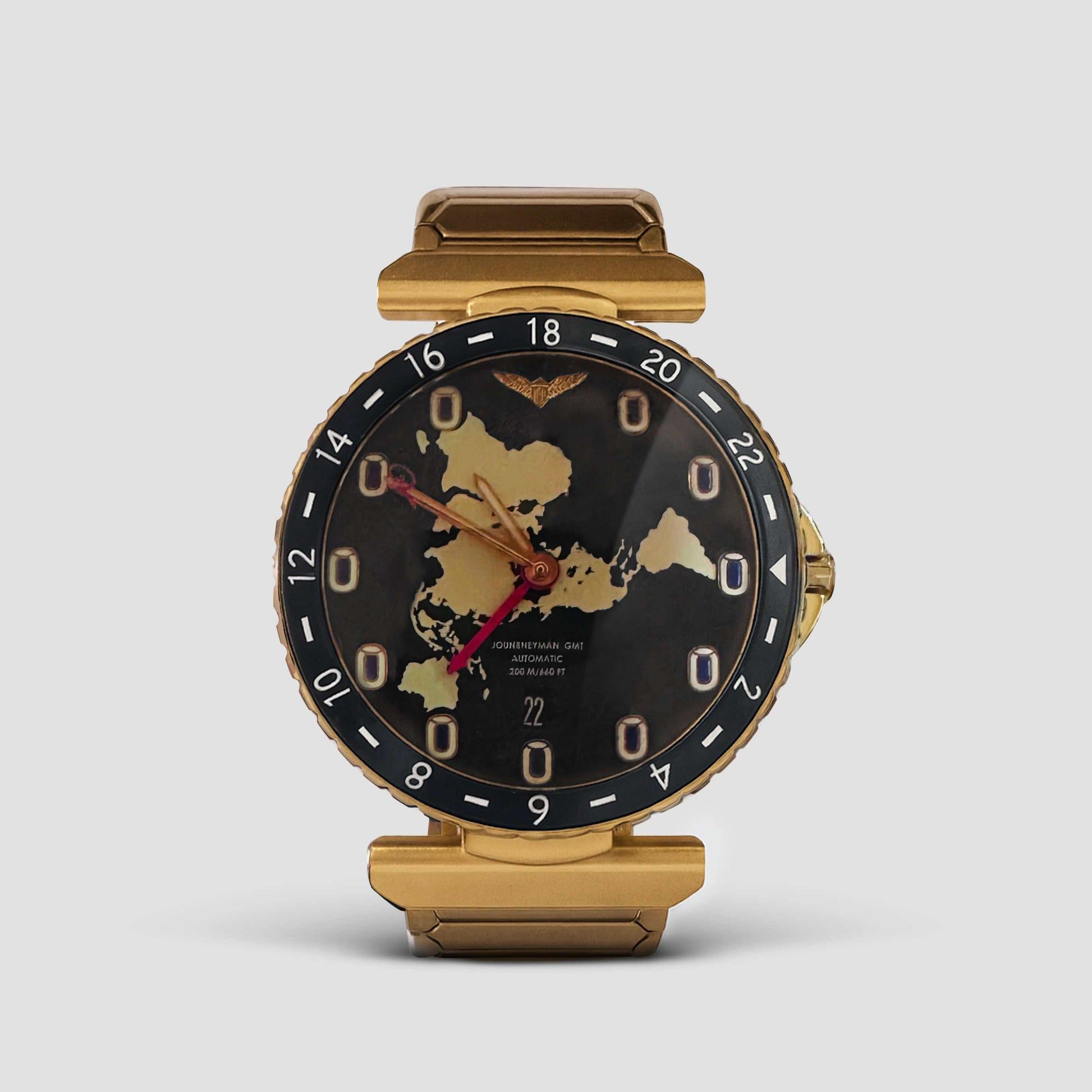 Journeyman GMT watch with world map dial, red GMT hand, brushed gold finish, and 43mm automatic case