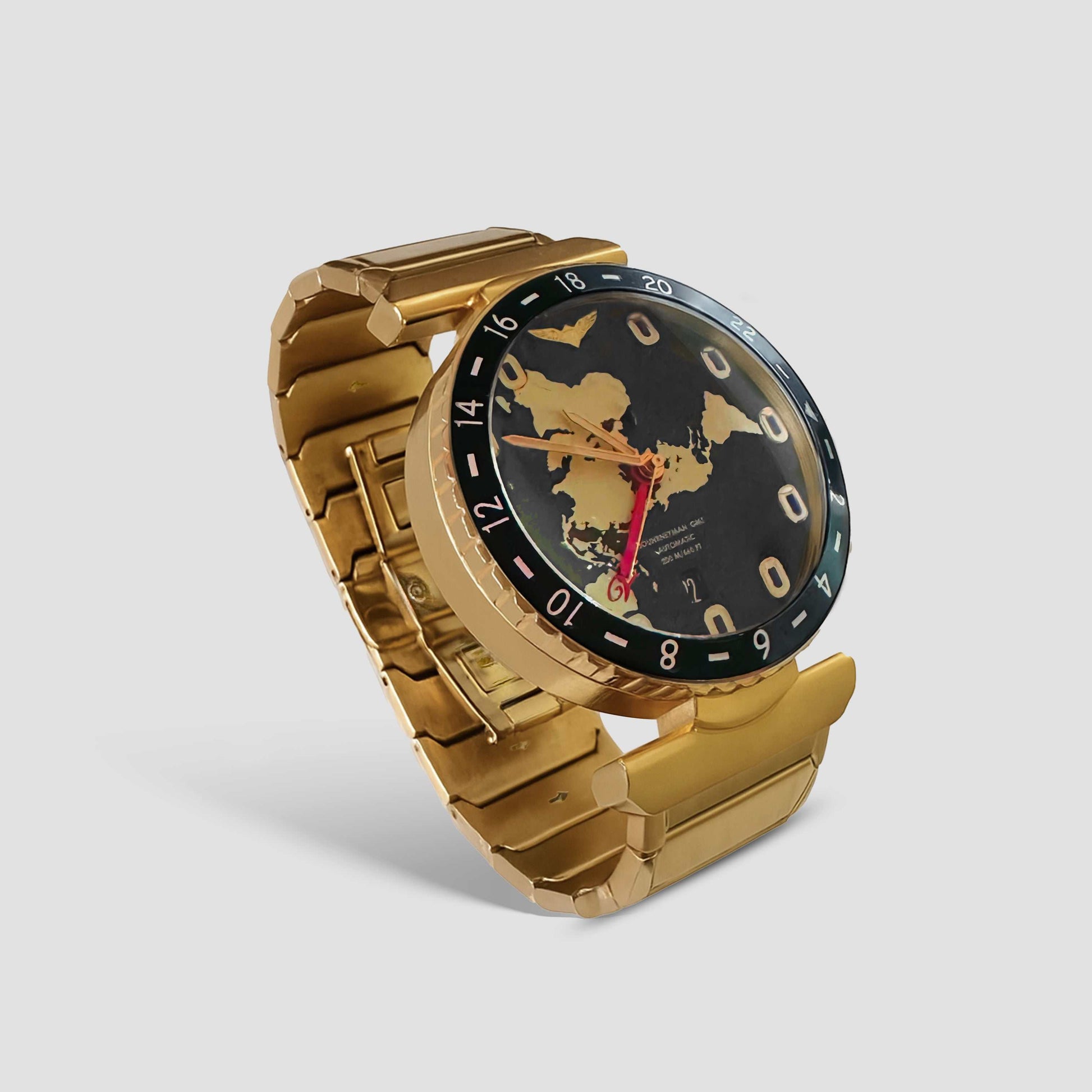 Gold Journeyman GMT watch with world map dial, red GMT hand, airplane-themed hour markers, and brushed finish on metal bracelet