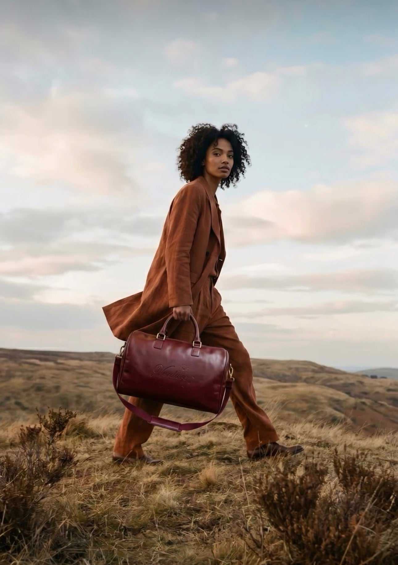 Journeyman Duffle bag with genuine cowhide, reinforced stitching, multiple interior pockets, and structured design for travel