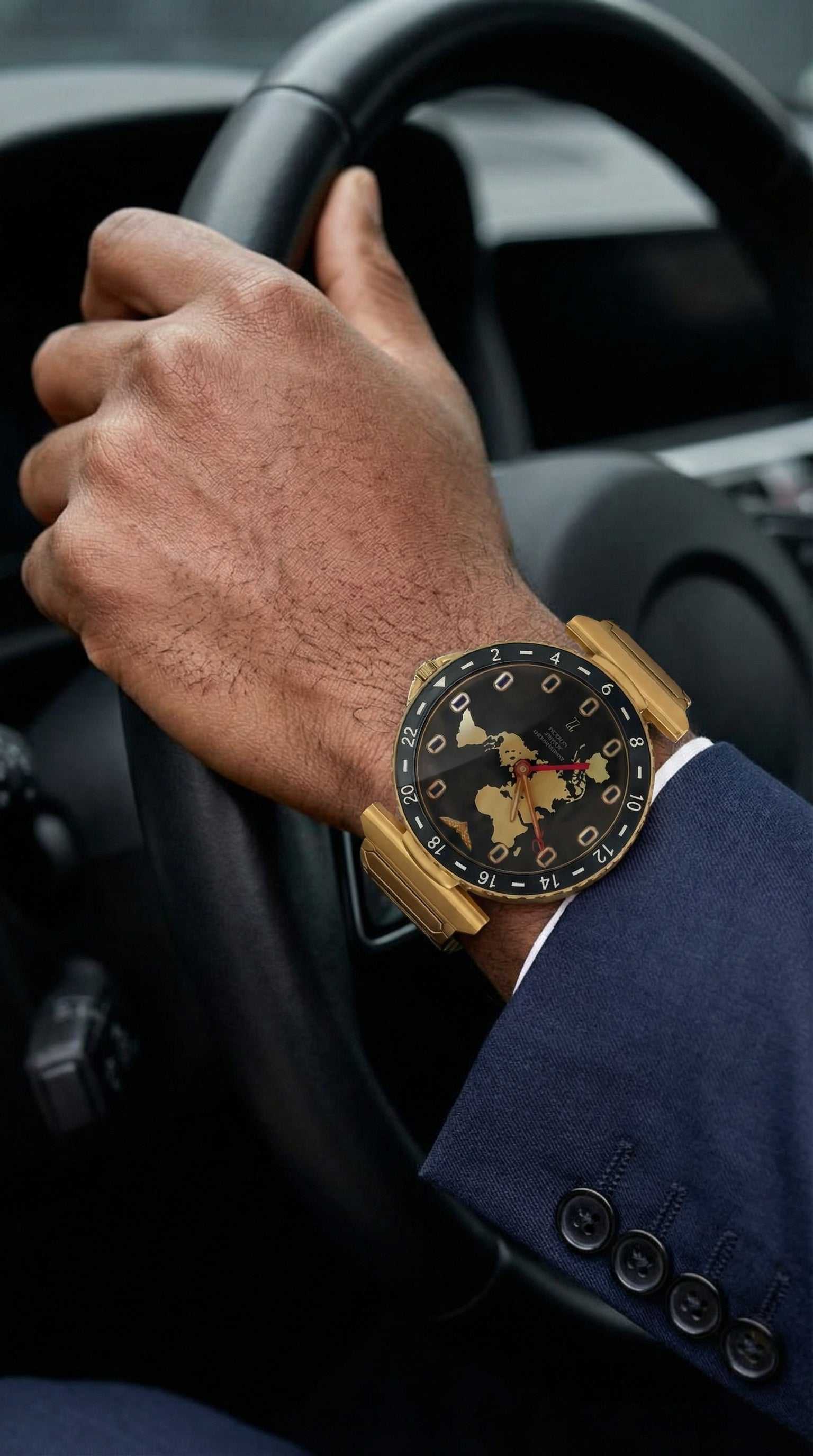 Journeyman GMT watch with world map dial, red GMT hand, airplane window hour markers, and brushed 43mm finish