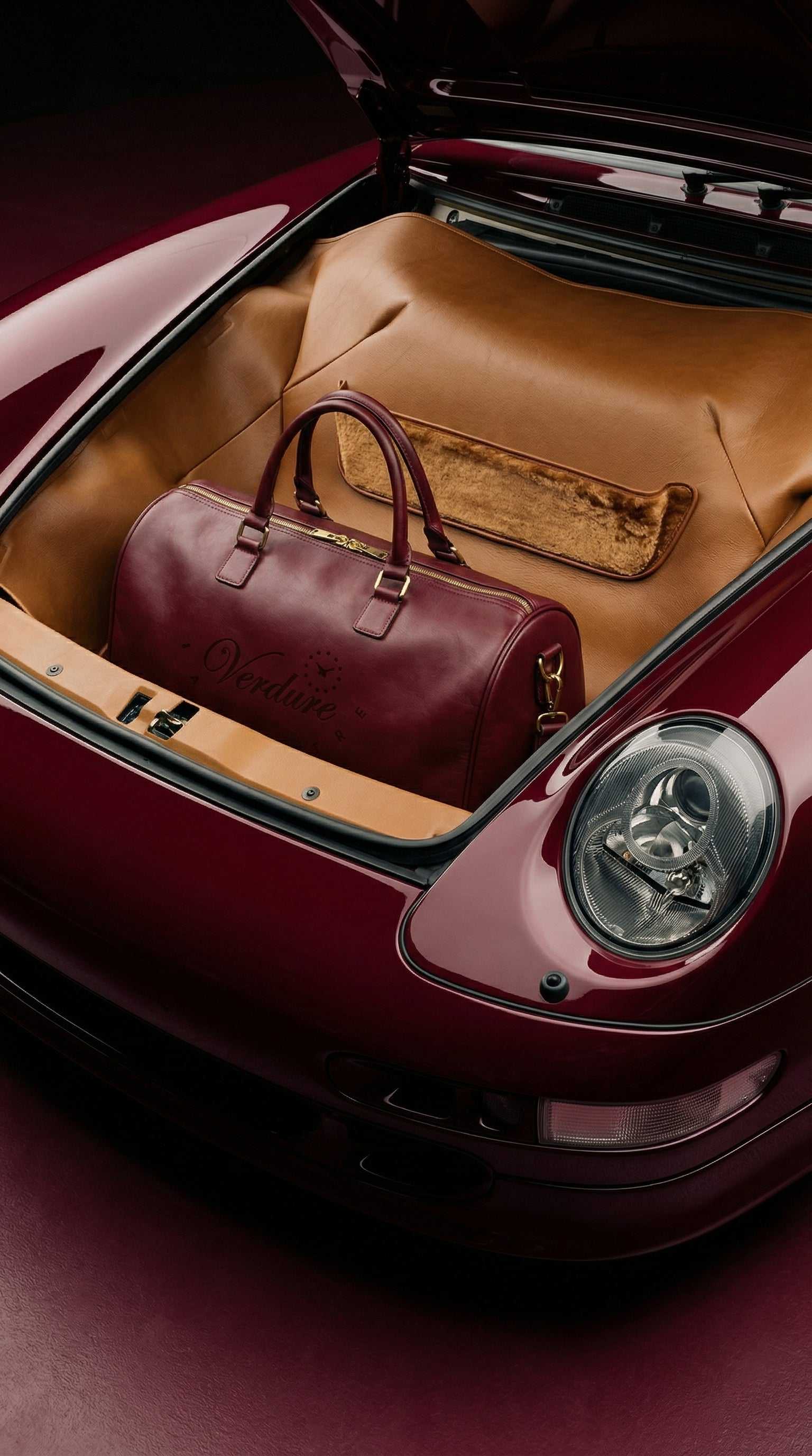 Journeyman Duffle bag with genuine cowhide leather, reinforced stitching, and multiple interior pockets for organized travel gear
